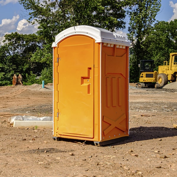 how often are the portable restrooms cleaned and serviced during a rental period in Troy Mills